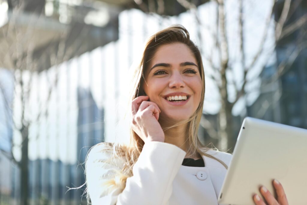 Business woman talking enthusiastically on the phone